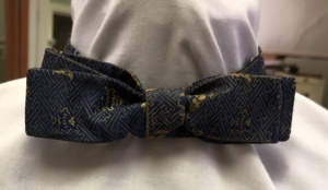 Blue and gold Bowtie-BWTI 4016- Corridor design with emblems, has matching cummerbun and handkerchief