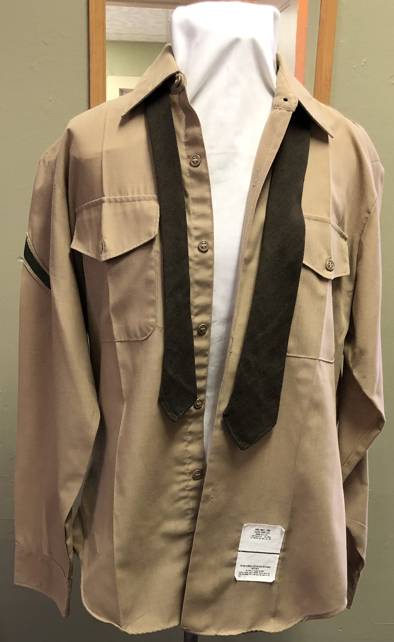 tan military shirt