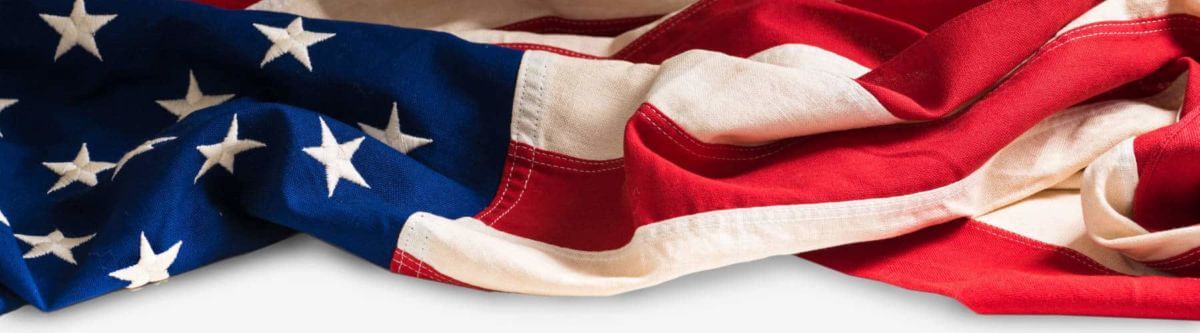 A vintage flag of the United States of America on white with copy space