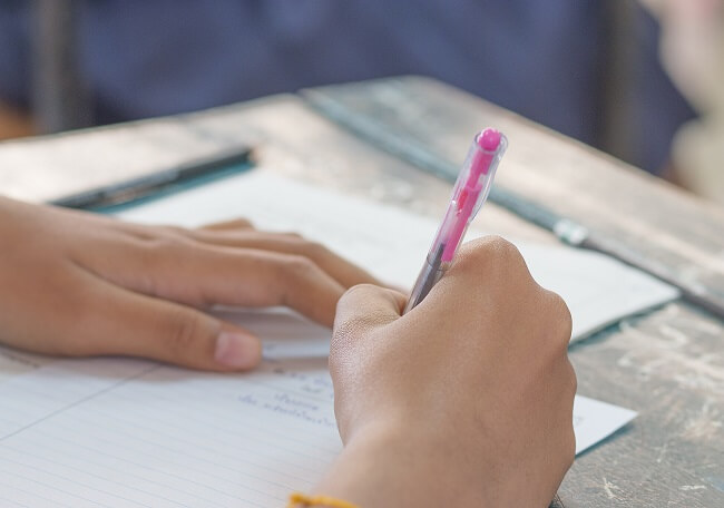 Thai student writing a test in exercise Exams selective focus Thai student writing a test in exercise Exams selective focus