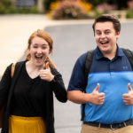 Two students enjoying a walk across campus.
