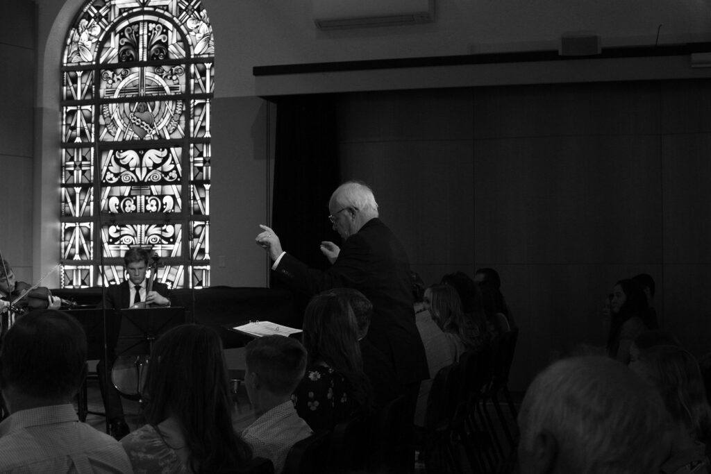 Dr. David Ledgerwood conducts a Maranatha choir.